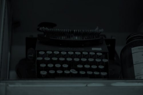 typewriter with green overlay