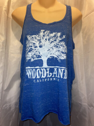 a blue tanktop with a white Woodland logo featuring a silhouette of a large tree